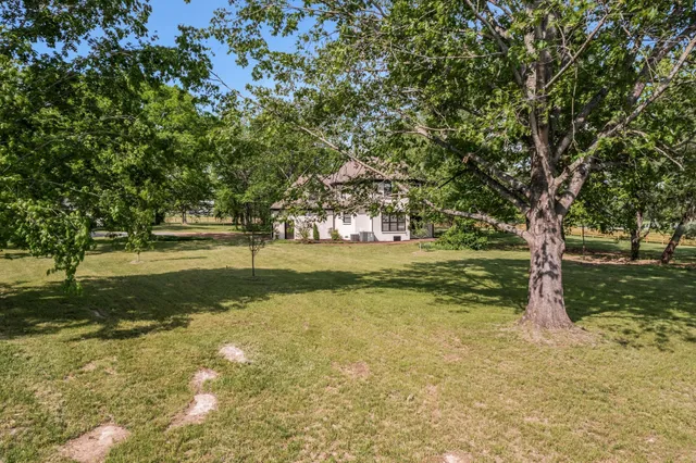 a house with trees in front of it