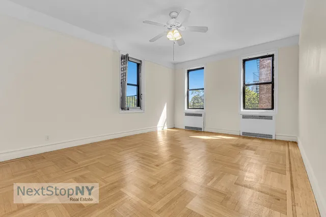 a bed room with a bed and a chandelier