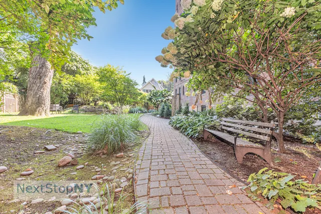 a bathroom with a sink a mirror and a shower