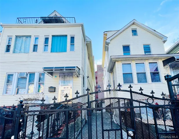 a front view of a house with many windows