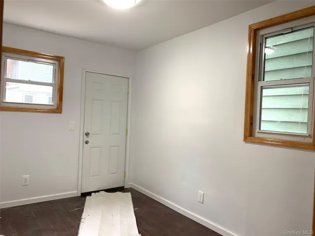 a view of room with window and closet