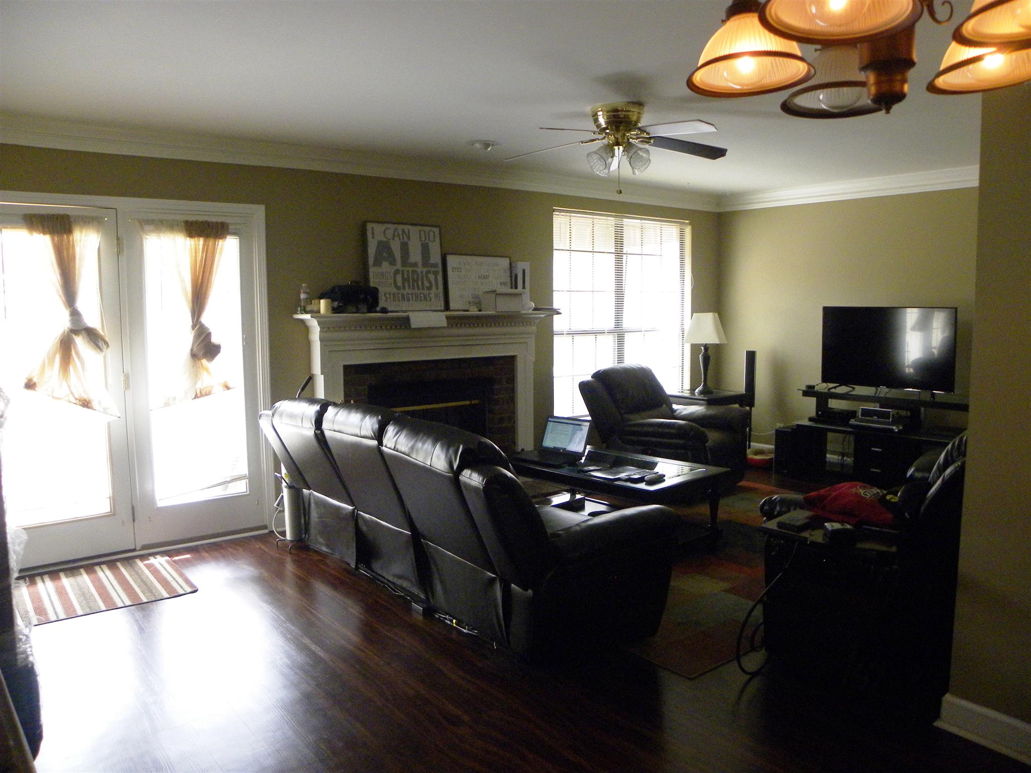 745 General George Patton Road Nashville, TN 37221 - Photo 4 of 12 a living room with furniture a flat screen tv and a fireplace