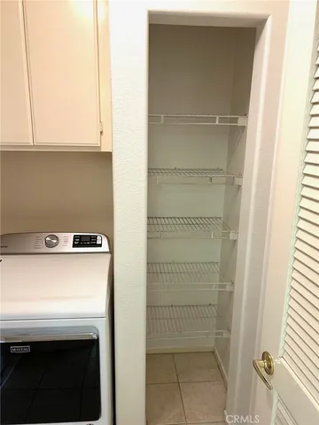 a backyard of a house with a garden and seating space