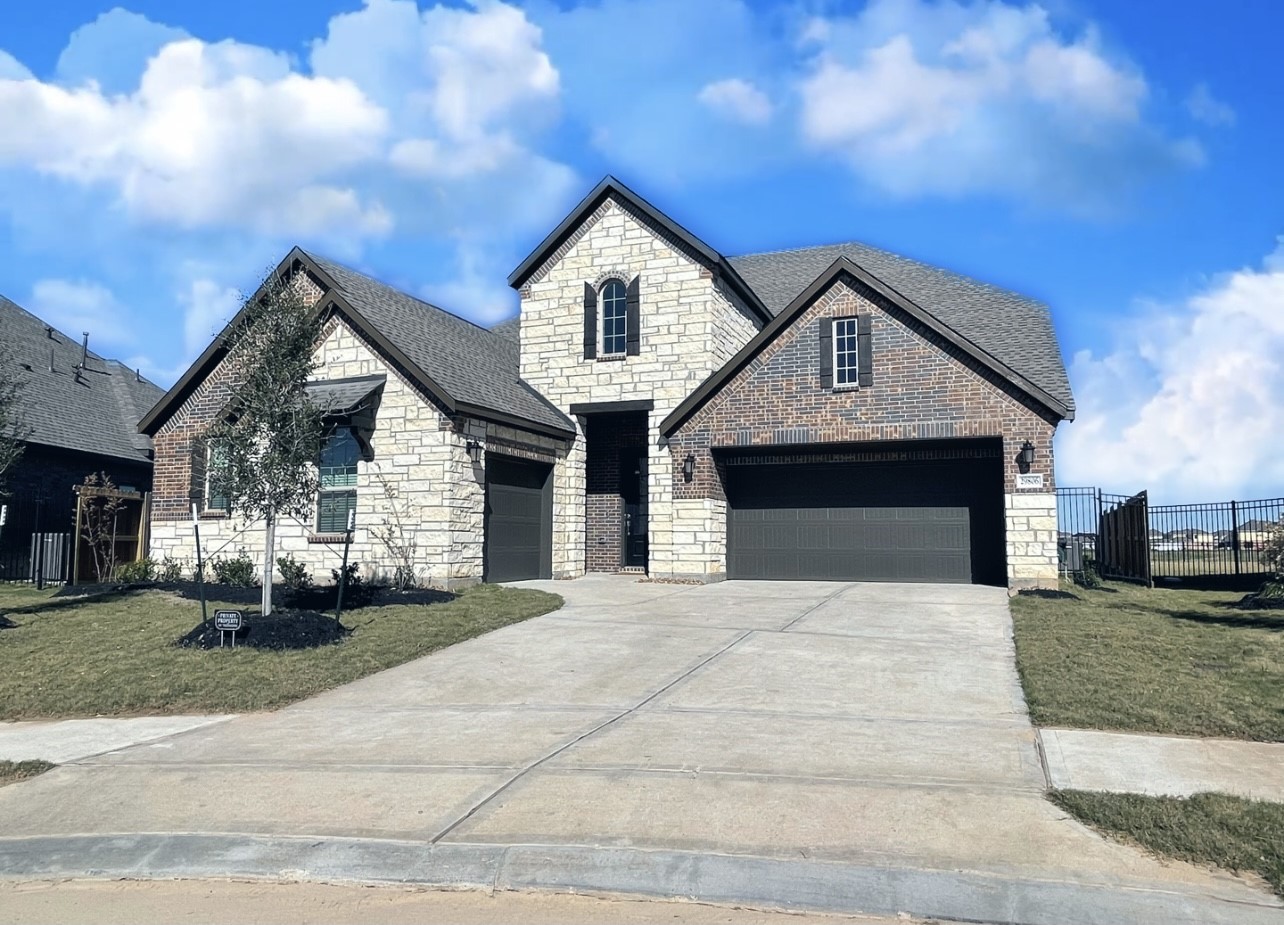 29806 Cherry Vine Road Katy, TX 77494 - Photo 1 of 30 a front view of a house with a yard
