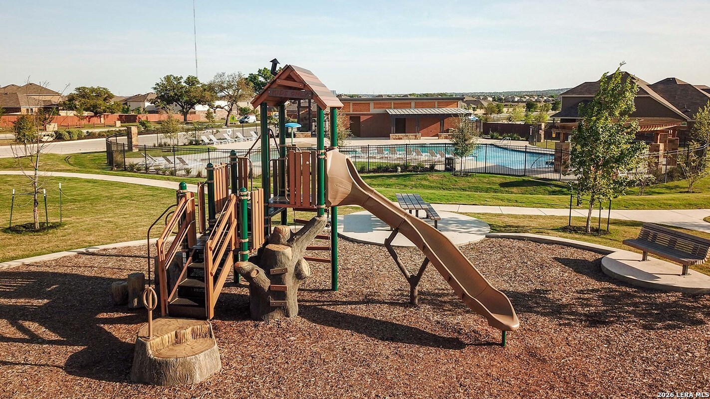 12317 Horowitz San Antonio, TX 78254 - Photo 3 of 7 a view of a swimming pool with a patio