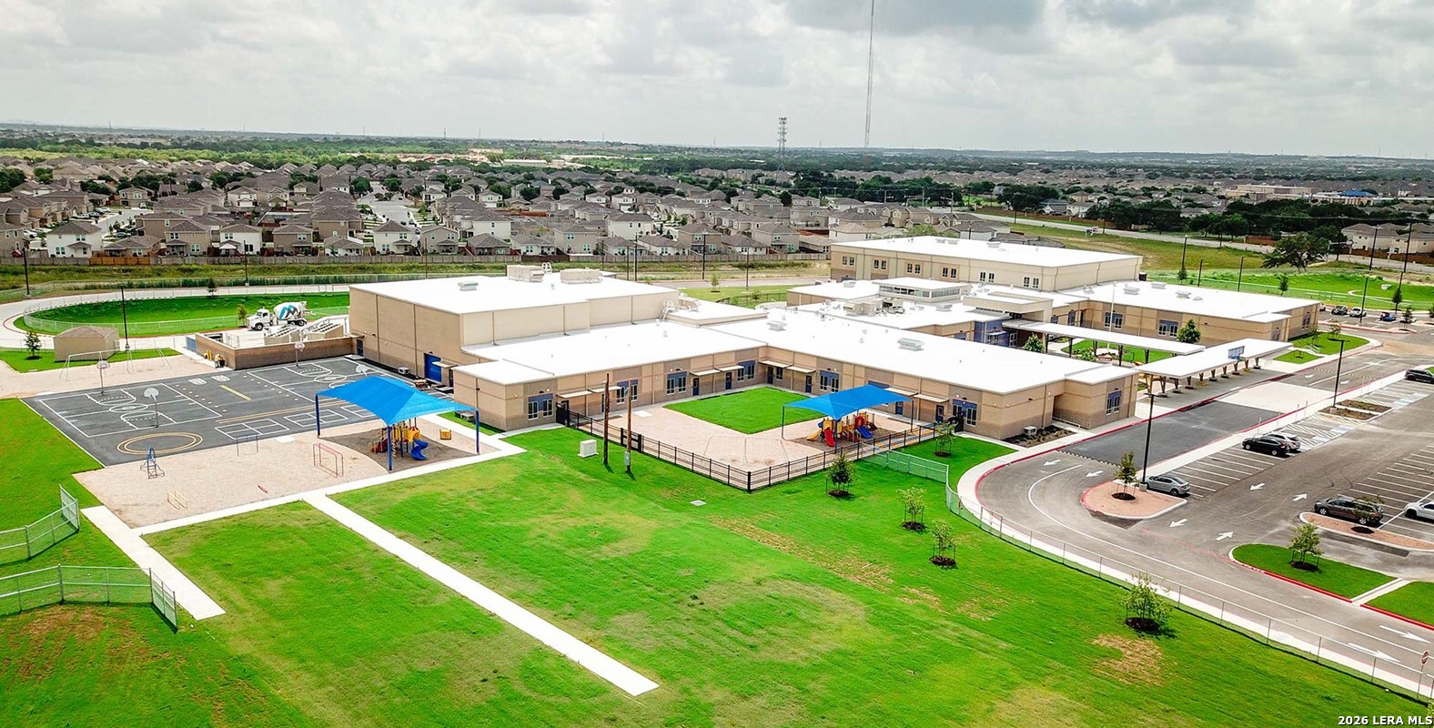 12317 Horowitz San Antonio, TX 78254 - Photo 6 of 7 an aerial view of a house with a garden and lake view