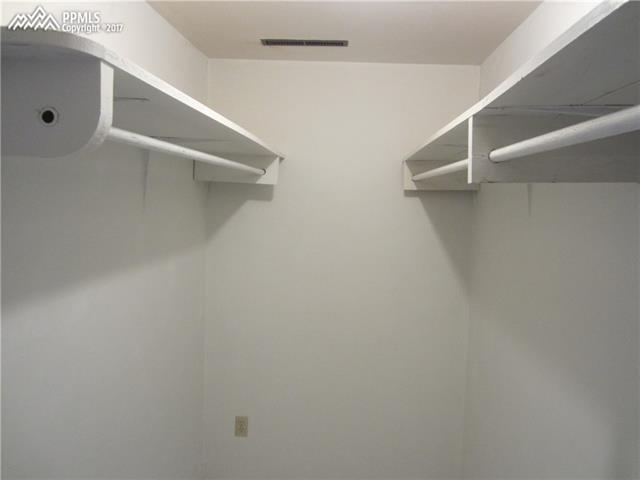 823 Cresta Road Colorado Springs, CO 80905 - Photo 29 of 36 Walk-in closet attached to lower level fifth bedroom.