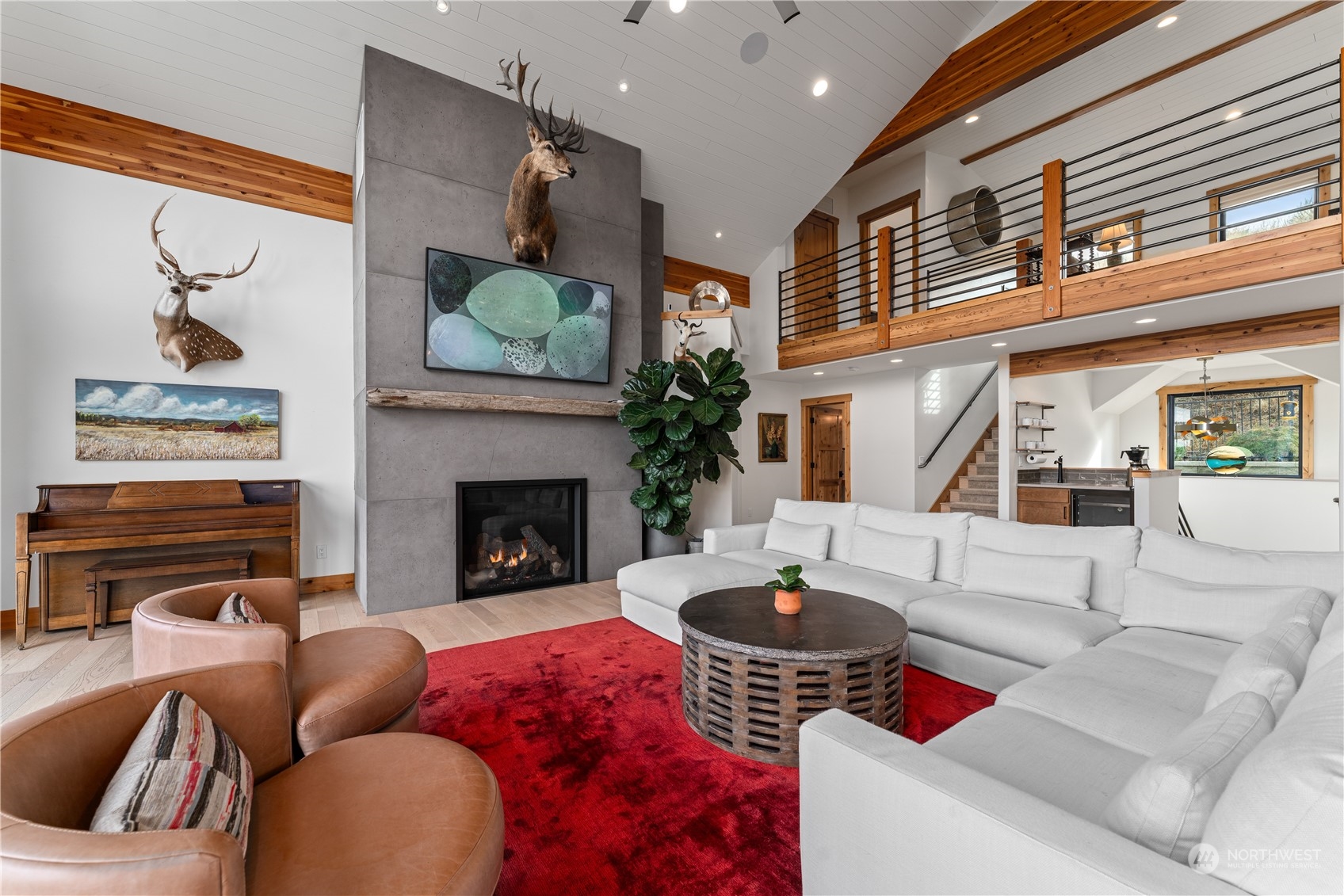 225 Turtle Rock Road East Wenatchee, WA 98802 - Photo 19 of 40 a living room with furniture potted plant and a fireplace