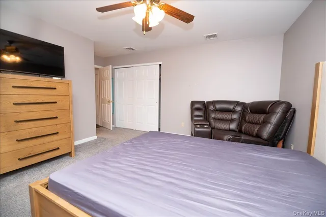 a livingroom with furniture and a flat screen tv