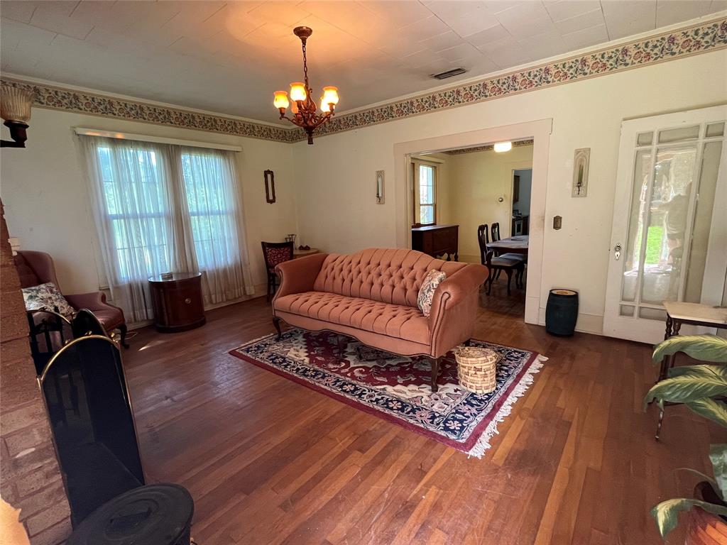 a living room with furniture rug and window