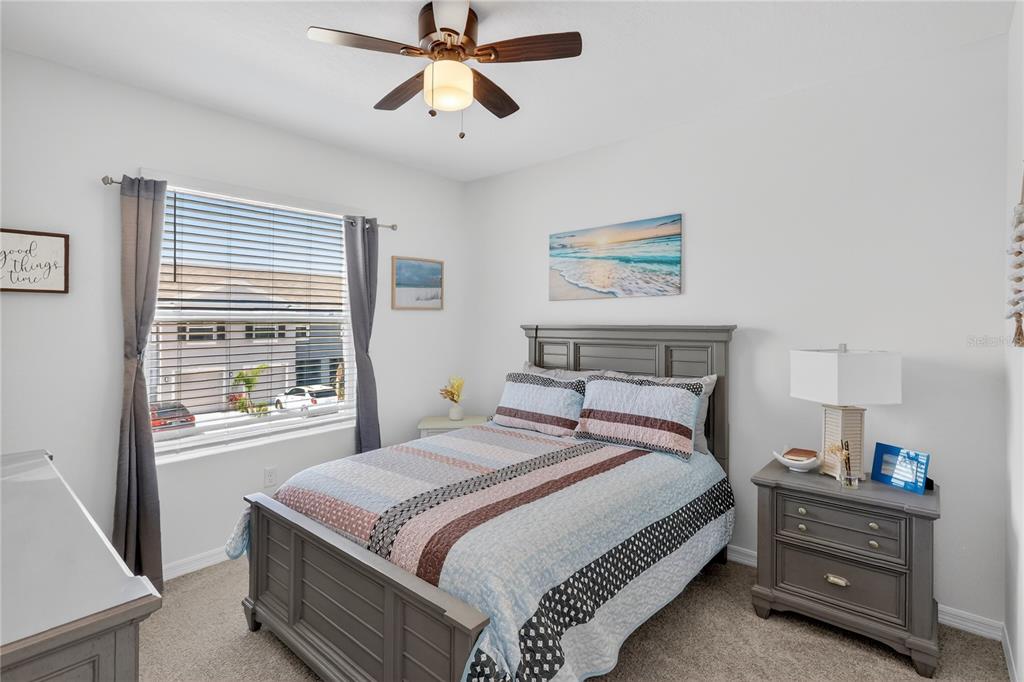 16632 Grotto Steam Place Wimauma, FL 33598 - Photo 17 of 42 a bedroom with a bed and a window