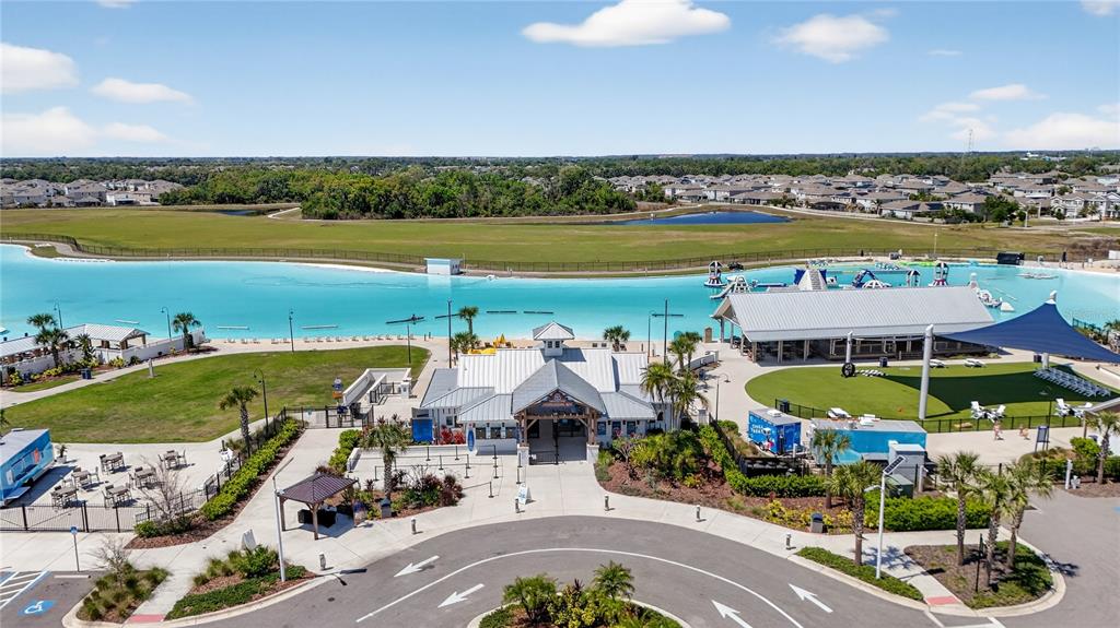 16632 Grotto Steam Place Wimauma, FL 33598 - Photo 2 of 42 a view of a swimming pool and an outdoor seating
