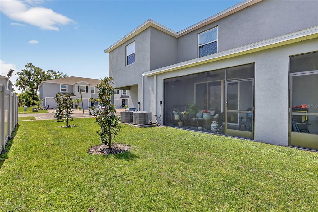 16632 Grotto Steam Place Wimauma, FL 33598 - Photo 30 of 42 a view of a backyard with a garden and plants