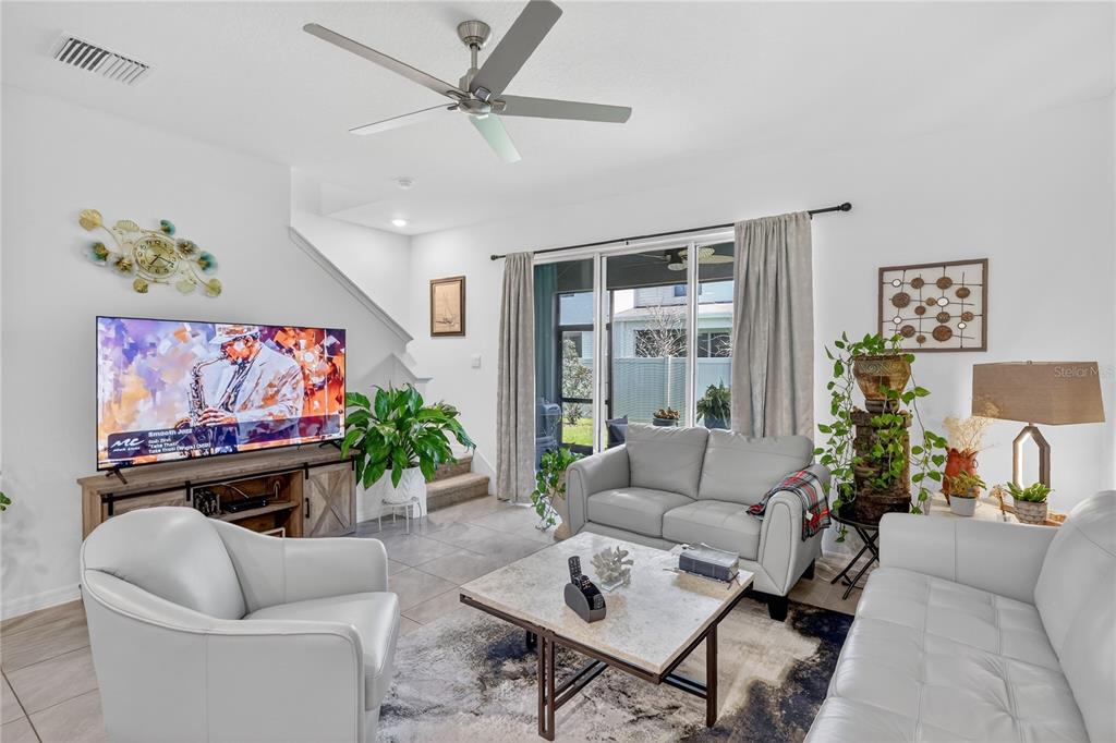 16632 Grotto Steam Place Wimauma, FL 33598 - Photo 5 of 42 a living room with furniture and a flat screen tv