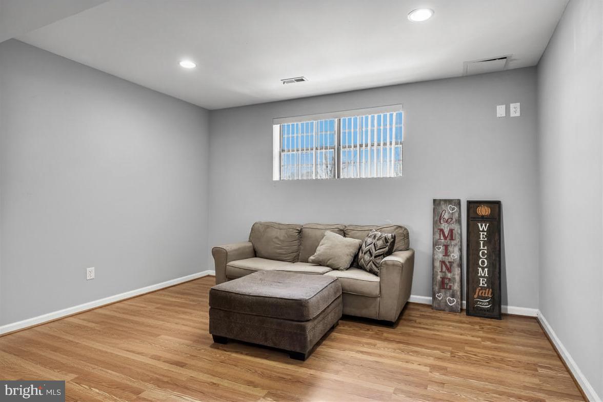 293 Waterford-Blue Anchor Road Hammonton, NJ 08037 - Photo 18 of 24 a living room with furniture and a wooden floor