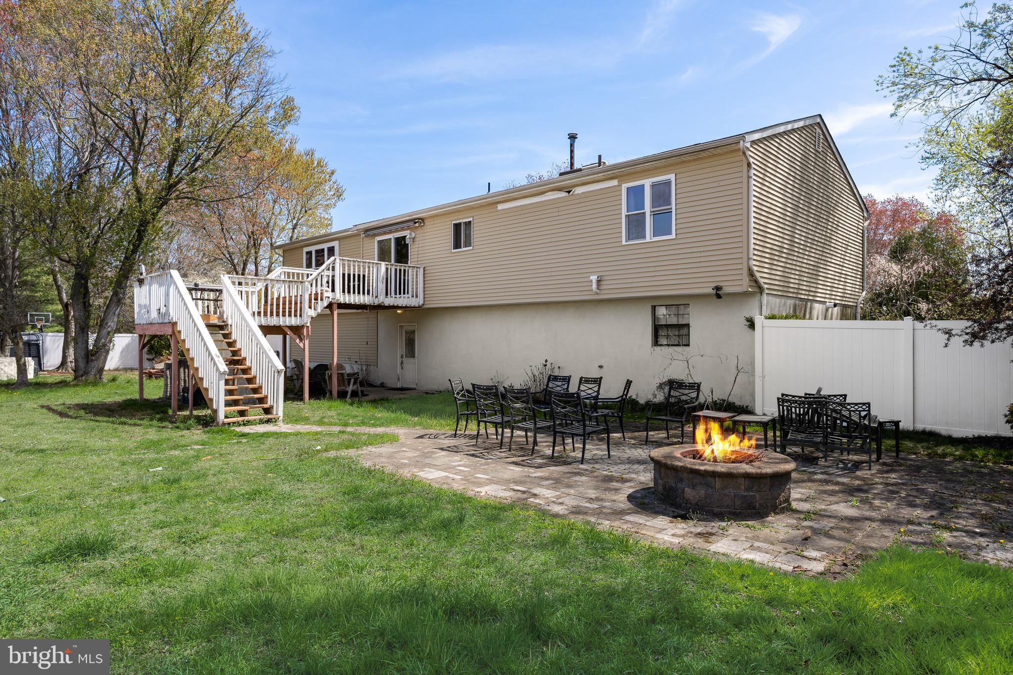 293 Waterford-Blue Anchor Road Hammonton, NJ 08037 - Photo 20 of 24 a view of a backyard with table and chairs and a slide