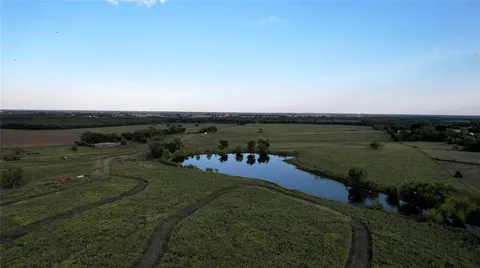 an aerial view of a houses with outdoor space