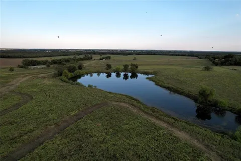 an aerial view of a houses with outdoor space