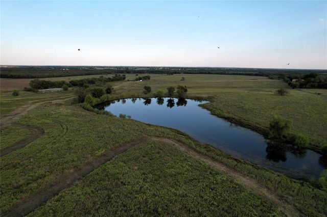 an aerial view of a houses with outdoor space