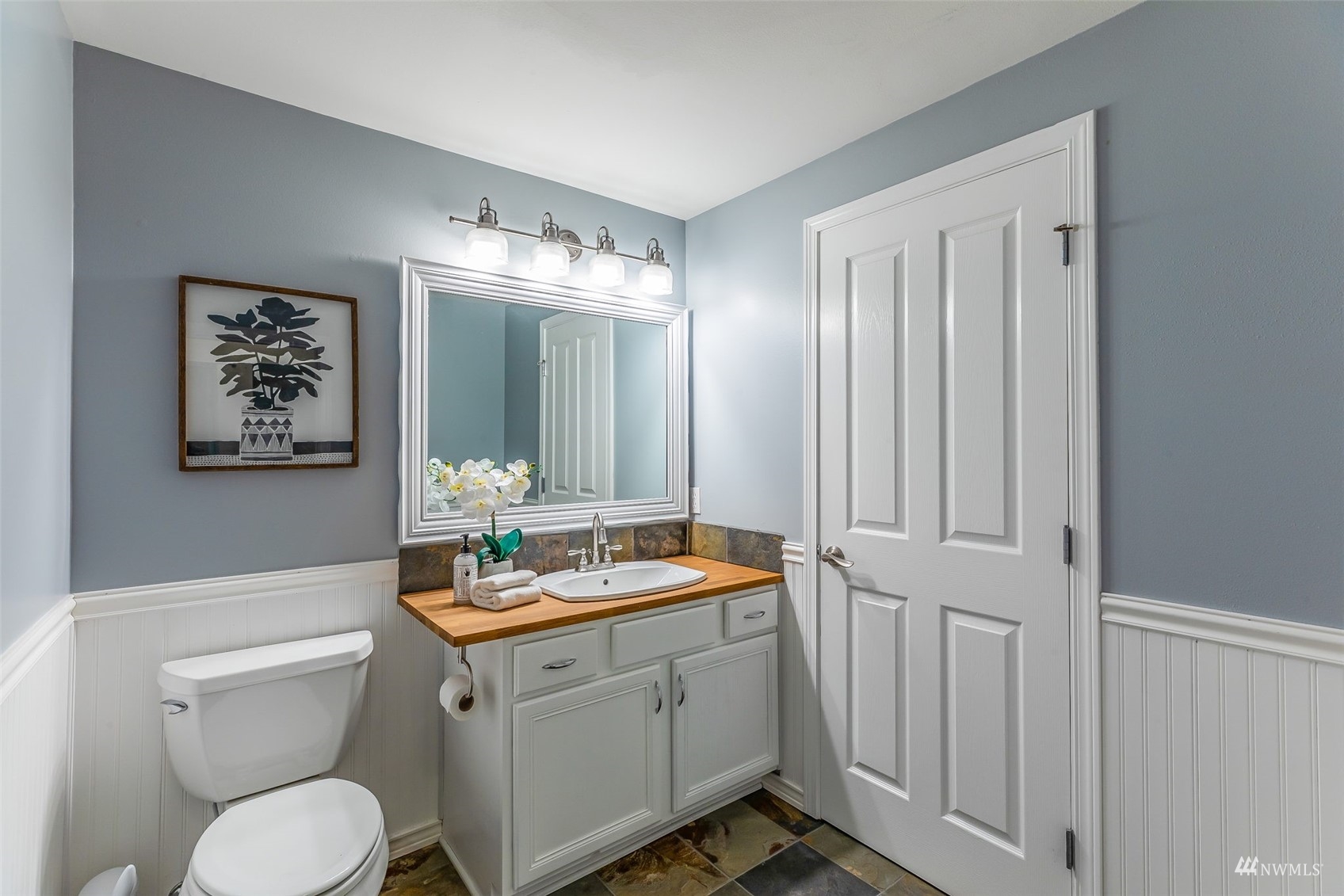 22110 14th Avenue West Bothell, WA 98021 - Photo 25 of 40 a bathroom with a toilet sink and mirror