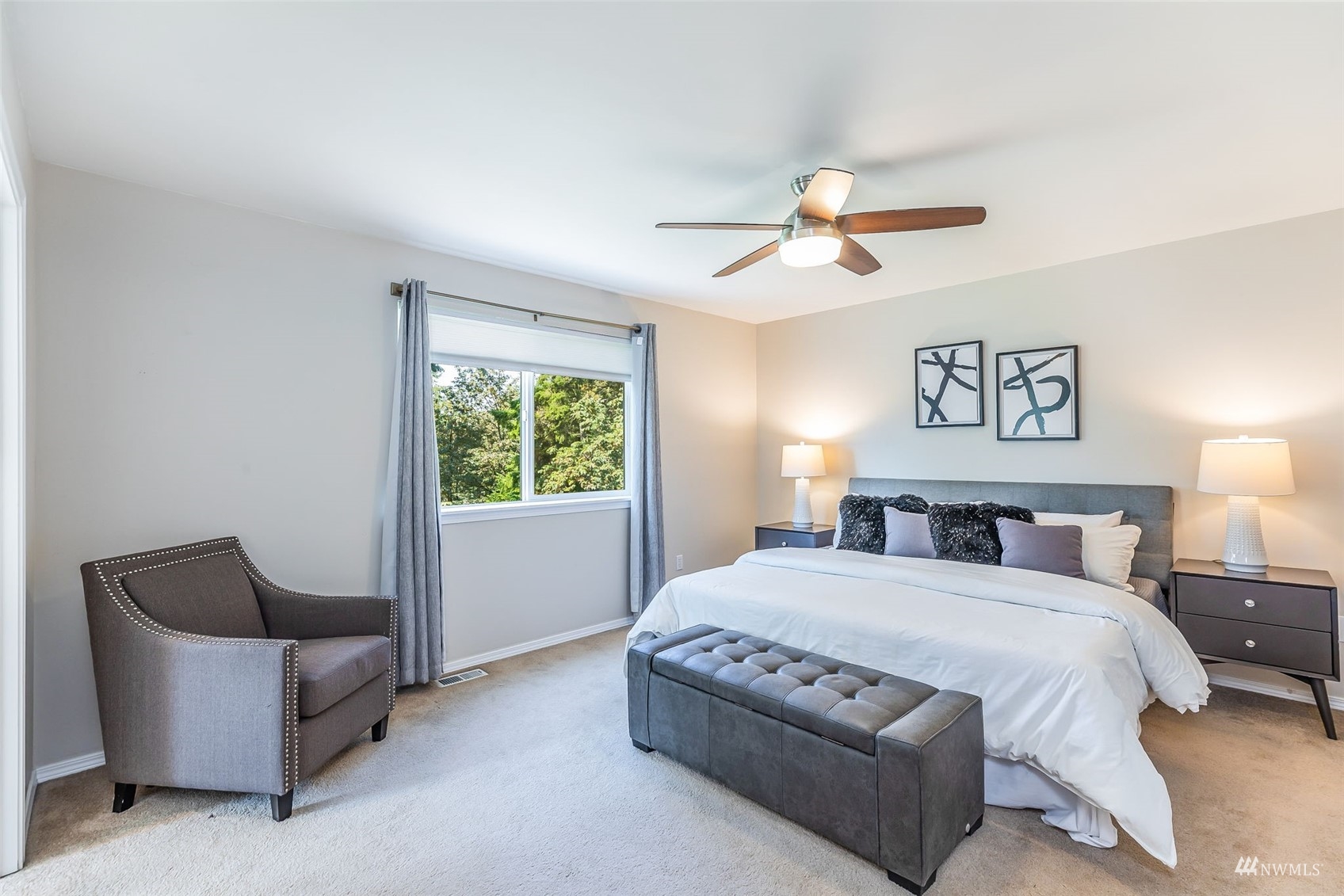 22110 14th Avenue West Bothell, WA 98021 - Photo 28 of 40 a spacious bedroom with a bed and a couch