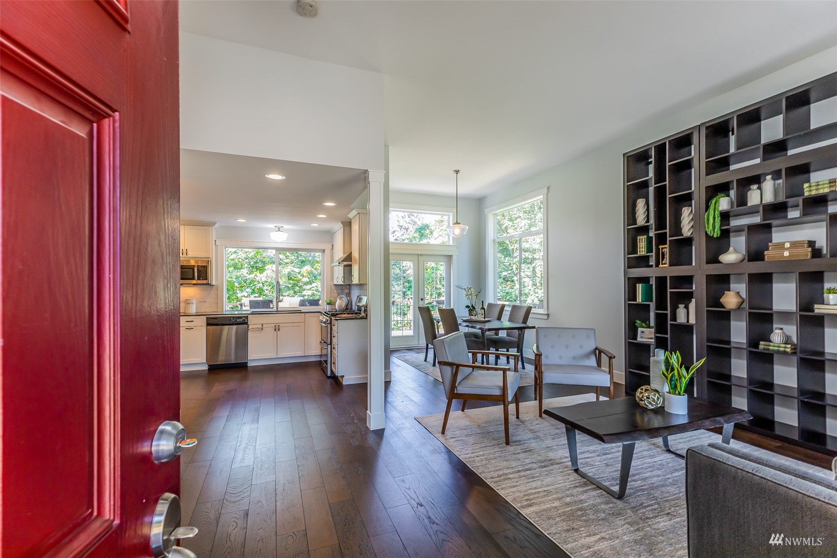 22110 14th Avenue West Bothell, WA 98021 - Photo 4 of 40 a living room with furniture a bookshelf and a book shelf