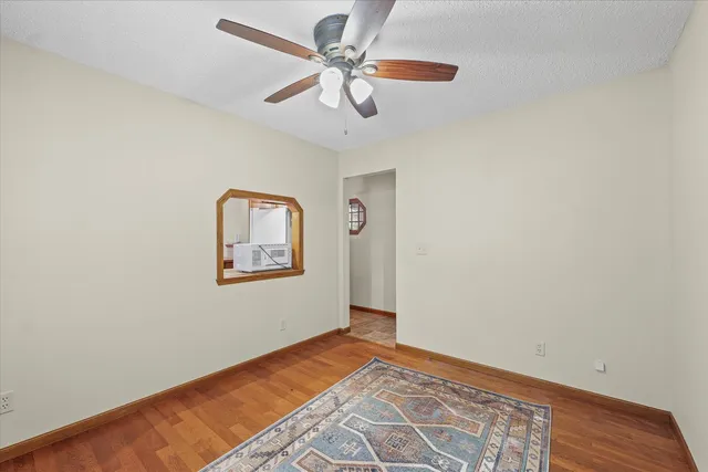 a bathroom with a sink a toilet and shower curtain