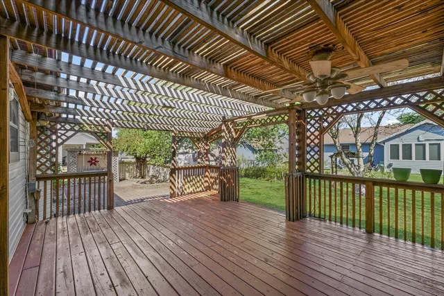 a front view of a house with yard and green space