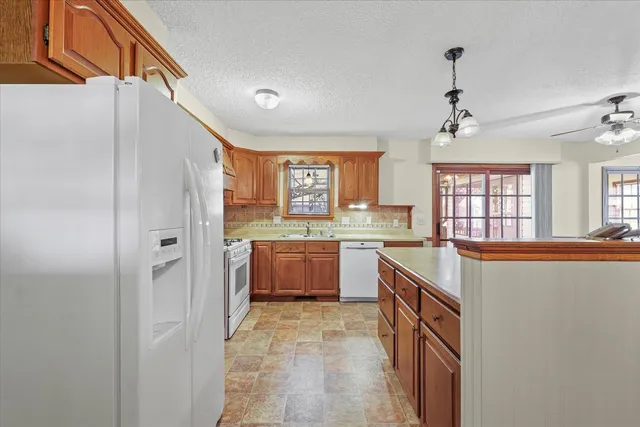 a large kitchen with a large window