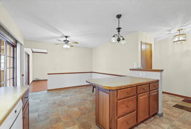 a kitchen with a stove a sink and a refrigerator