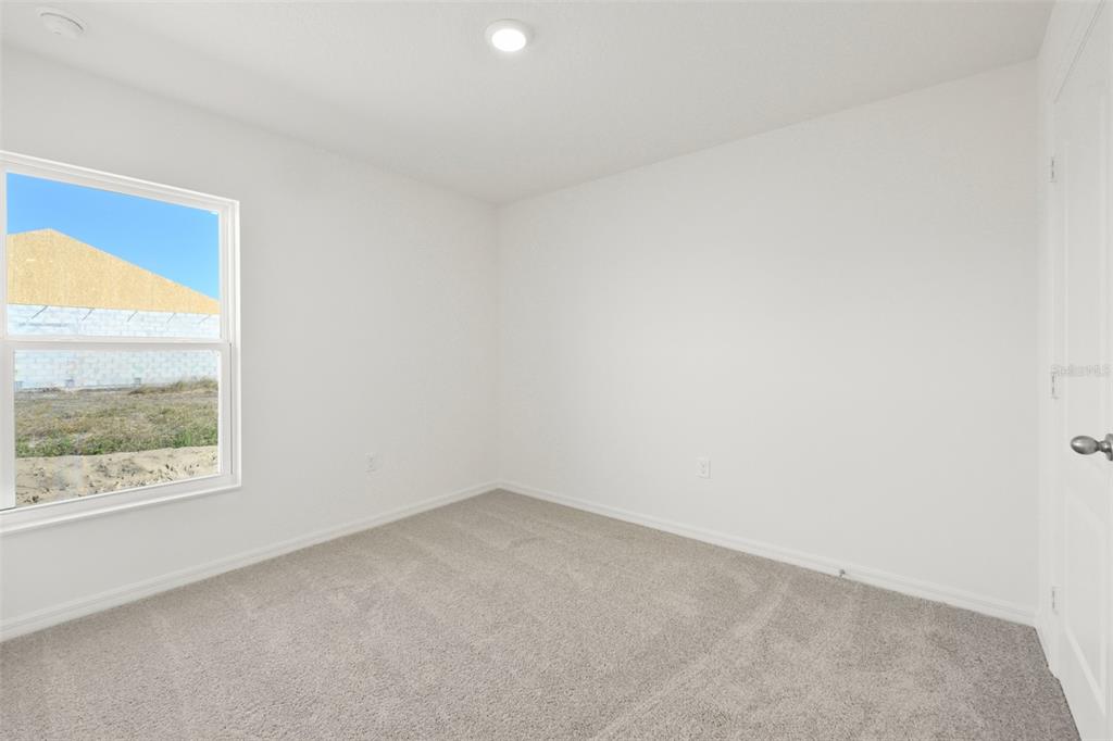 13328 Tula Loop Astatula, FL 34705 - Photo 15 of 18 an empty room with a window