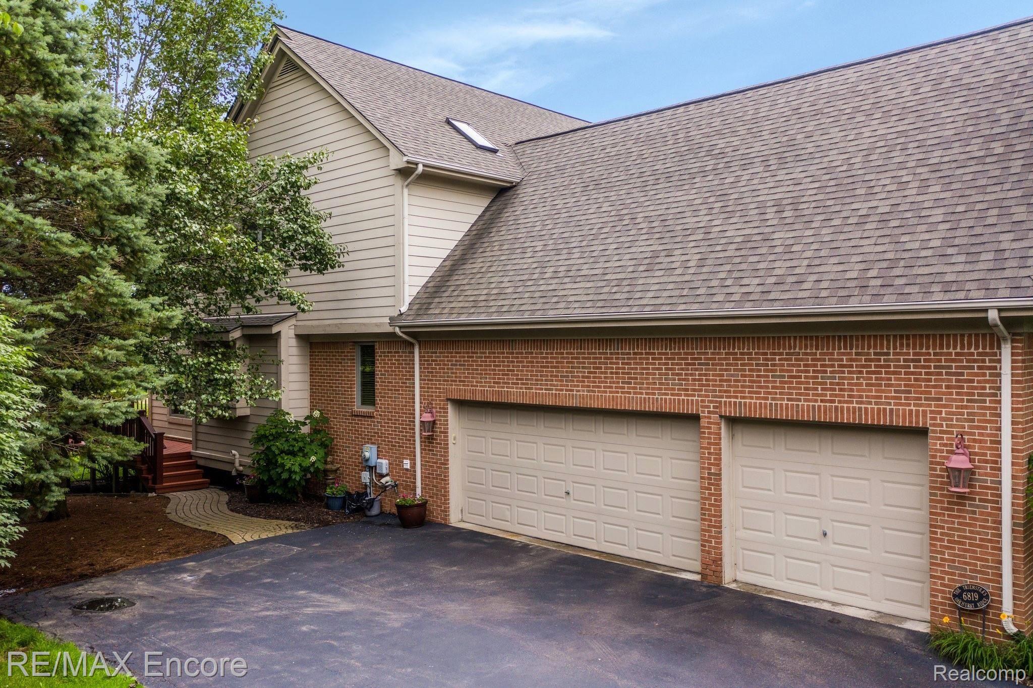 6819 Oakhurst Ridge Road Clarkston, MI 48348 - Photo 10 of 46 3-Car Garage with plenty of space for a golf cart