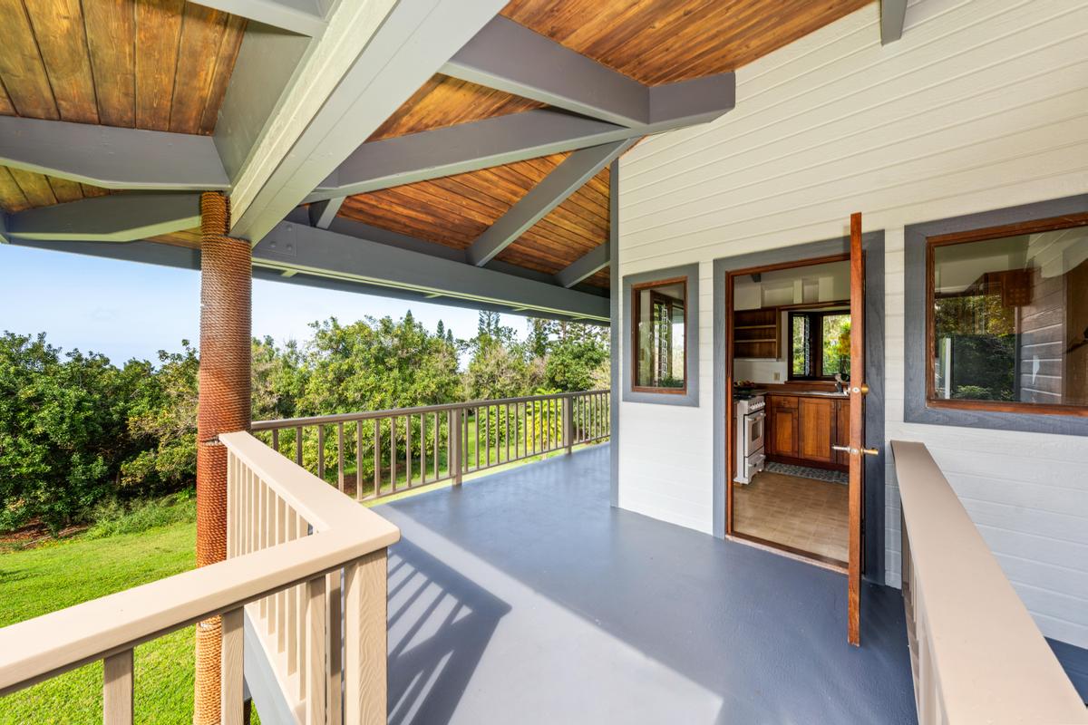 88-2497 Milolii Road Captain Cook, HI 96704 - Photo 11 of 30 a view of a porch with furniture and backyard