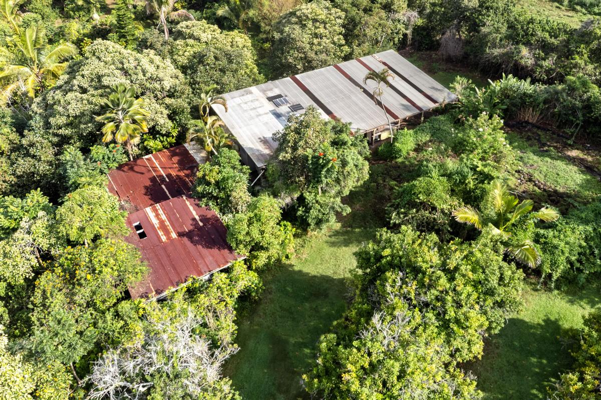 88-2497 Milolii Road Captain Cook, HI 96704 - Photo 3 of 30 an aerial view of a house with a yard