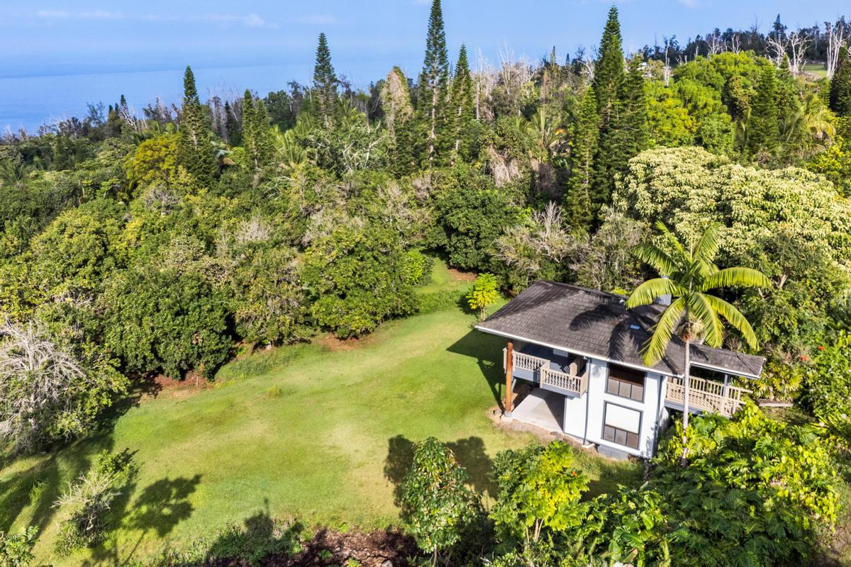 88-2497 Milolii Road Captain Cook, HI 96704 - Photo 7 of 30 a view of a house with a yard from a balcony