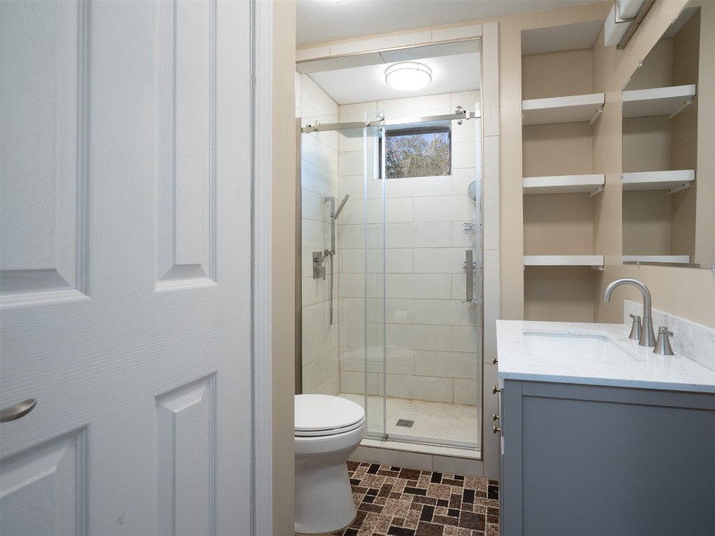 97578 Pirates Point Road Yulee, FL 32097 - Photo 11 of 64 a bathroom with a shower a toilet and sink