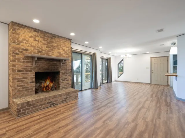 a kitchen with stainless steel appliances granite countertop refrigerator sink and cabinets