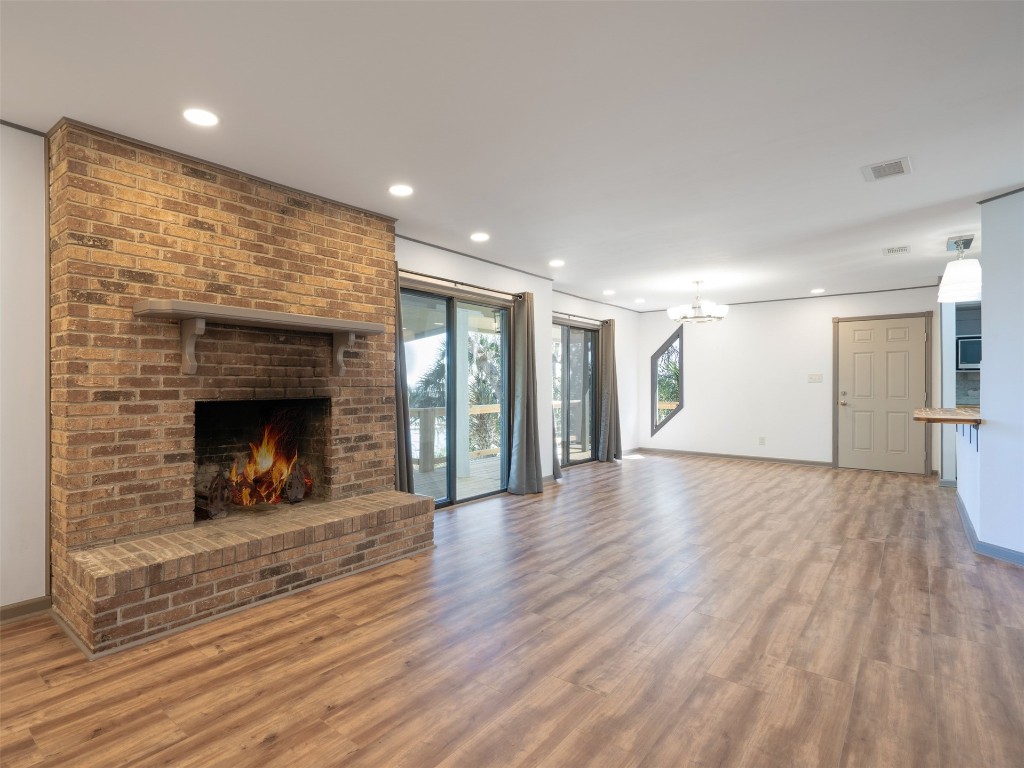 97578 Pirates Point Road Yulee, FL 32097 - Photo 16 of 64 a view of a room wooden floor and a fireplace