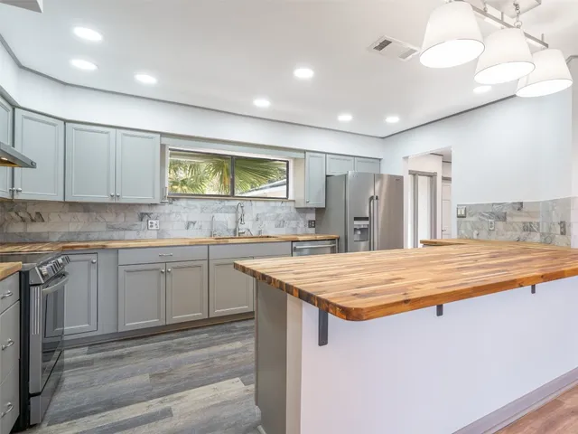 a white toilet sitting next to a bathroom