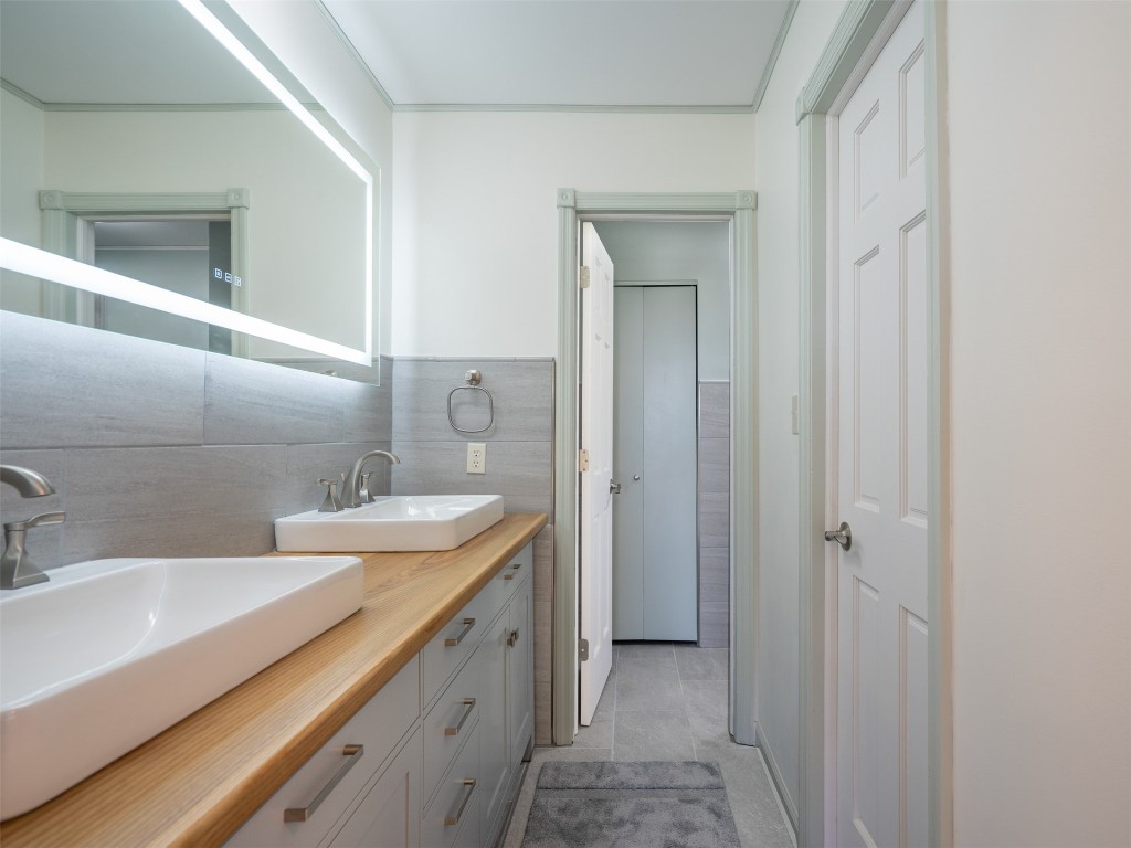 97578 Pirates Point Road Yulee, FL 32097 - Photo 30 of 64 a bathroom with a sink and a mirror