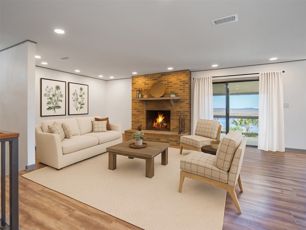 97578 Pirates Point Road Yulee, FL 32097 - Photo 3 of 64 a living room with furniture and a fireplace