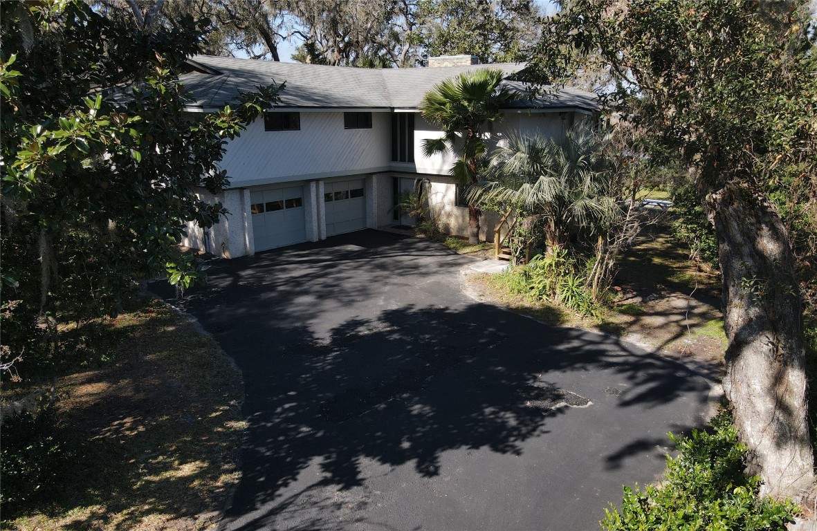 97578 Pirates Point Road Yulee, FL 32097 - Photo 48 of 64 a view of a house with a tree