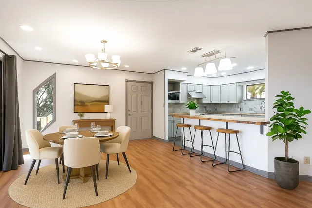 a spacious bedroom with a bed and a large window