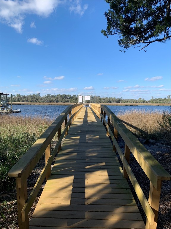 97578 Pirates Point Road Yulee, FL 32097 - Photo 58 of 64 a view of a balcony with wooden floor and lake view