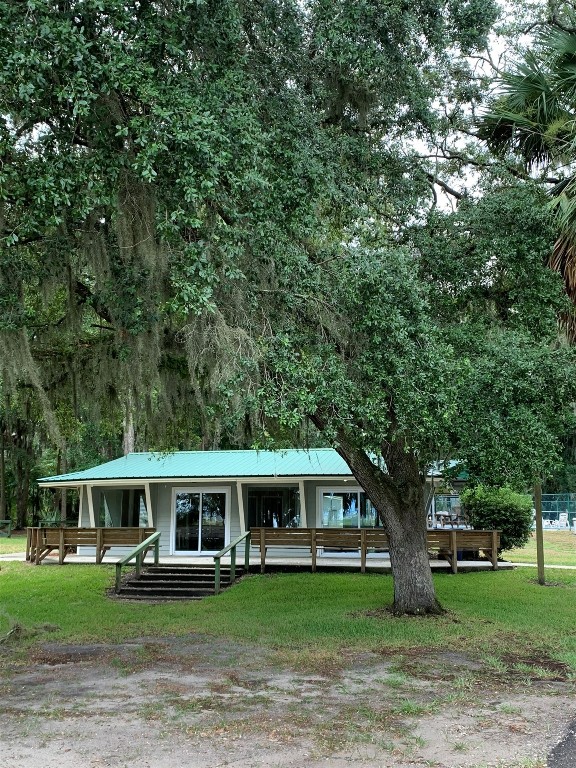97578 Pirates Point Road Yulee, FL 32097 - Photo 59 of 64 a front view of a house with garden