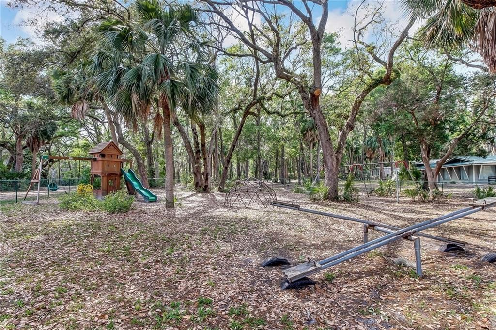 97578 Pirates Point Road Yulee, FL 32097 - Photo 61 of 64 a view of a park with large trees
