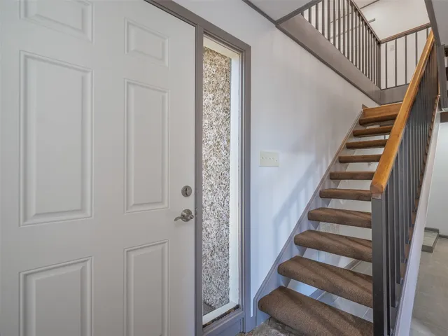 a view of entryway with wooden floor