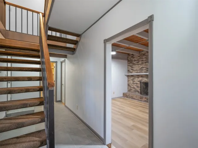 a bathroom with a shower a toilet and sink