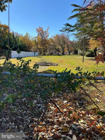 a view of a lake with houses in the background