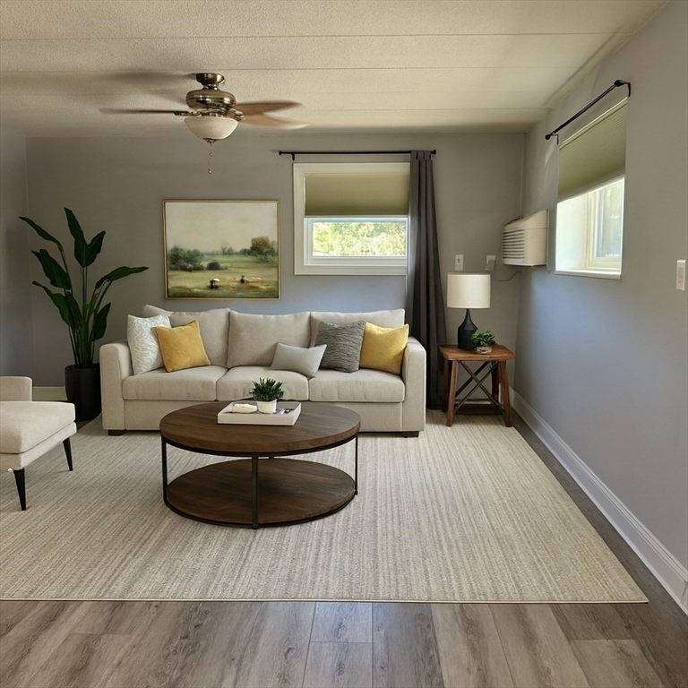 a living room with furniture and a lamp